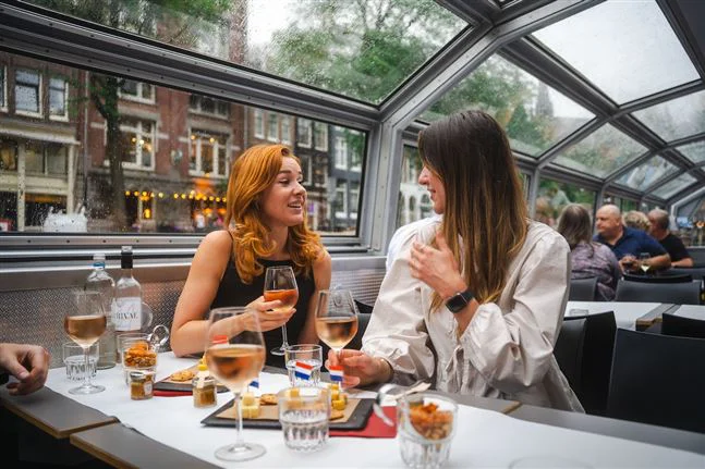 Two friends during a cheese and wine cruise
